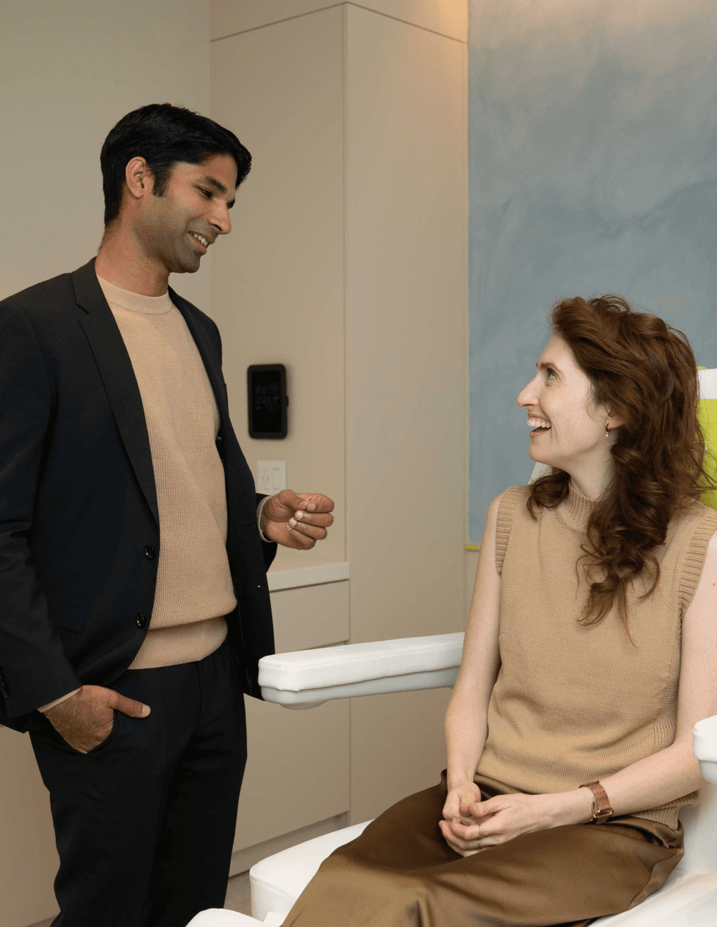 A Modern Age clinician in conversation with a client in a treatment suite