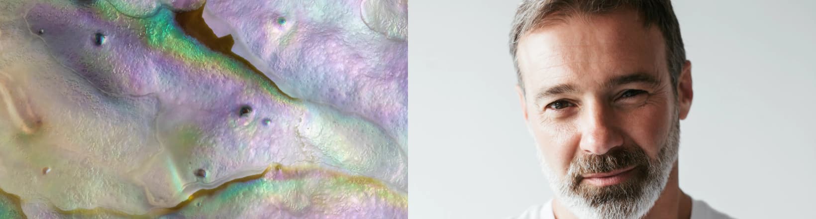 A man's portrait against a soft abstract texture